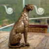 Cheetah sitting bronze sculpture