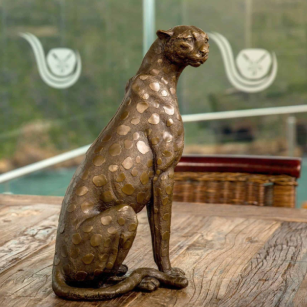 Cheetah sitting bronze sculpture