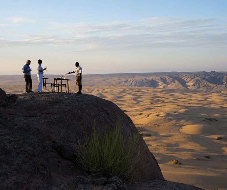 Snacks ontop of mountain with view of desert